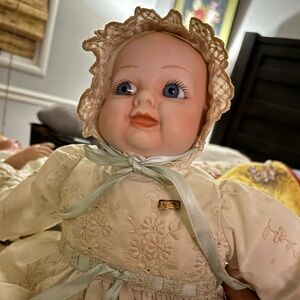 All you Doll Lovers!!  Excellent condition porcelain doll with filled torso